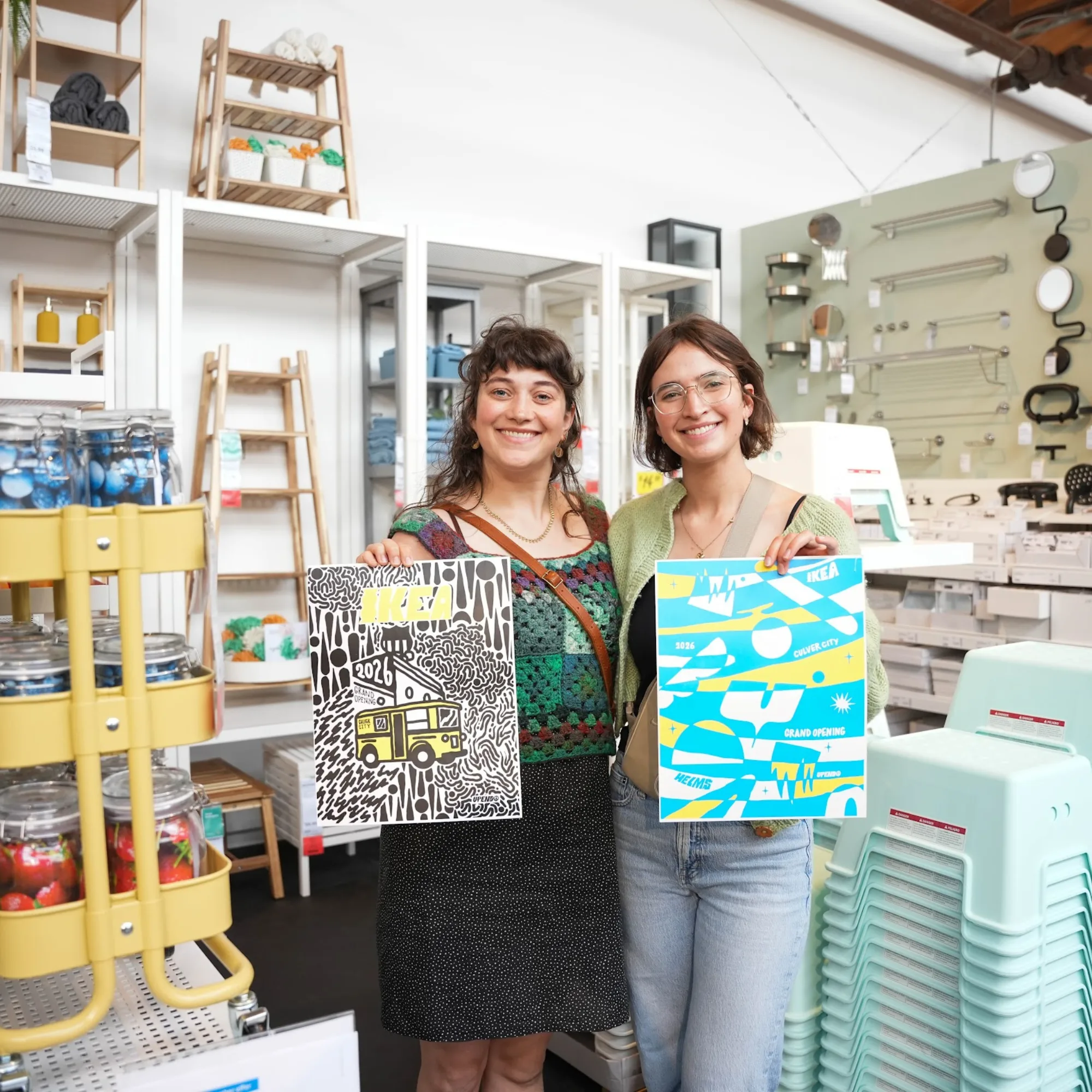 Attendees inside IKEA Culver City holding prints by Upendo